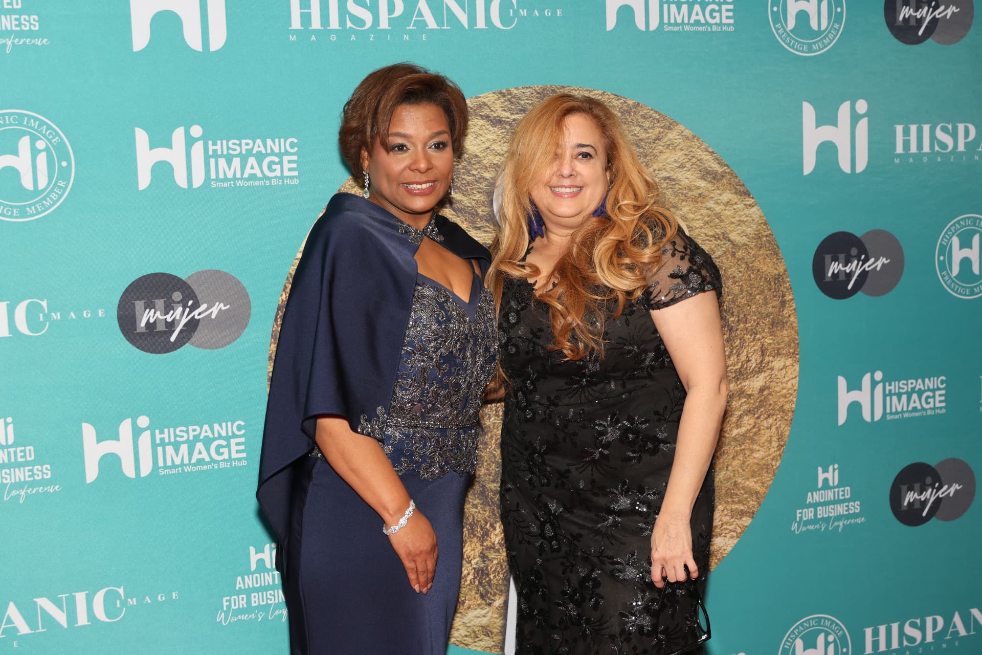 Guests photographed on the Hispanic Image Gala step-and-repeat